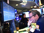 Traders work during the opening bell at the New York Stock Exchange (NYSE) on March 5, 2020 at Wall Street in New York City. - Wall Street stocks tumbled again in opening trading Thursday on fears of a global slowdown due to the coronavirus, extending the run of volatility that has dominated markets in recent weeks.About 20 minutes into trading, the benchmark Dow Jones Industrial Average was down 2.8 percent, or more 750 points, at 26,324.68. The index surged nearly 1,200 points on Wednesday. (Photo by Johannes EISELE / AFP)