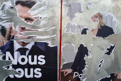 Carteles electorales rotos de Macron y Le Pen, en Lyon.