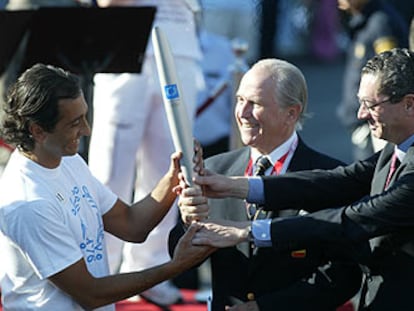 Estiarte (a la izquierda), con Echeverría, presidente del COE, y Ruiz-Gallardón.