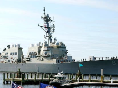 The USS Mason, an Arleigh Burke-class destroyer, passes a dock in Norfolk, Va., April 8, 2021.
