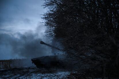 Ukrainian service members fire a 2S1 Gvozdika self-propelled howitzer toward Russian troops near the front line town of Kupiansk.