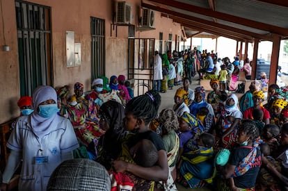 A group of mothers receive their children's positive malaria test results at the Nametil Health Center on August 9, 2023, in Mozambique.