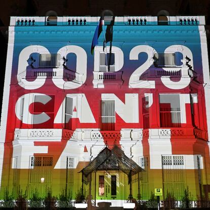 FILE PHOTO: Climate activists project a message onto the Embassy of Azerbaijan ahead of COP29 climate talks, in London, Britain, November 7, 2024. REUTERS/Chris J. Ratcliffe/File Photo