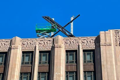 A large, metal "X" sign is seen on top of the downtown building that housed what was once Twitter, now rebranded by its owner, Elon Musk, in San Francisco, Friday, July 28, 2023.