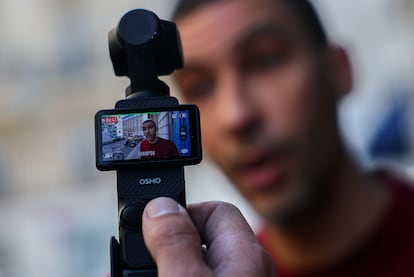 Nabil, who intervened when a masked gang attempted to kidnap the daughter of a crypto businessman, talks to the local media at Rue Pache street, in Paris, France, May 14, 2025. REUTERS/Gonzalo Fuentes