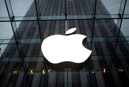 FILE PHOTO: FILE PHOTO: The Apple Inc. logo is seen in the lobby of New York City's flagship Apple store, U.S.