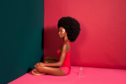 Woman with Afro in colorful room