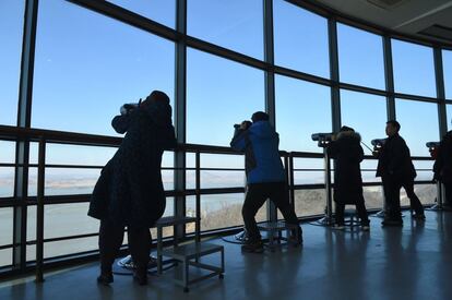 This photo taken on February 12, 2017 shows visitors looking through binoculars towards North Korea from a South Korean observation post in the border city of Paju, near the Demilitarized Zone (DMZ) dividing the two Koreas.
Built to keep out migrants, traffickers, or an enemy group, border walls have emerged as a one-size-fits-all response to the vulnerability felt by many societies in today's globalized world, says an expert on the phenomenon.
Practically non-existent at the end of World War II, by the time the Berlin Wall fell in 1989 the number of border walls across the globe had risen to 11.
That number has since jumped to 70, prompted by an increased sense of insecurity following the September 11, 2001 attacks in the United States and the 2011 Arab Spring, according to Elisabeth Vallet, director of the Observatory of Geopolitics at the University of Quebec in Montreal (UQAM).

This image is part of a photo package of 47 recent images to go with AFP story on walls, barriers and security fences around the world. More pictures available on afpforum.com / AFP PHOTO / JUNG Yeon-Je