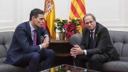 Els dos presidents i les tres plantes, grogues i vermelles.