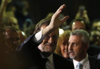 Mariano Rajoy greets supporters after being voted in the new prime minister of Spain.