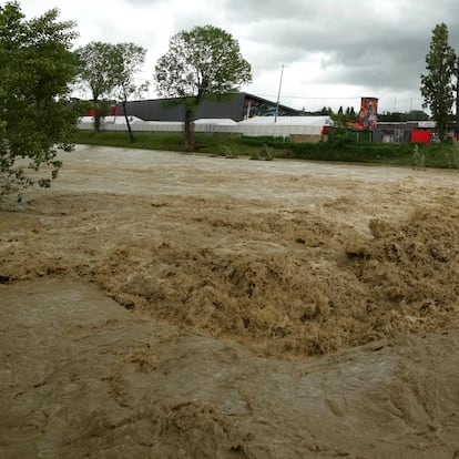 A view of the swollen Santerno River with behind the Enzo e Dino Ferrari circuit, in Imola, Italy, Wednesday, May 17, 2023. The weekend's Emilia-Romagna Grand Prix in Imola has been canceled because of deadly floods. Formula One said it made the decision for safety reasons and to avoid any extra burden on the emergency services. F1 personnel had earlier been told to stay away from the track after floods affected large parts of the Emilia-Romagna region. (AP Photo/Luca Bruno)