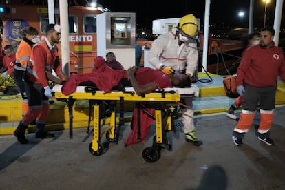 A migrant is taken to hospital after arriving at the port of Melilla.