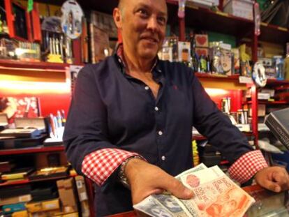 Fernando Losada still accepts pesetas at his Madrid stationery store.
