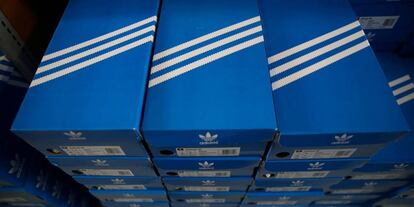 FILE PHOTO: Boxes of Adidas shoes are pictured in the warehouse of local footwear retailer &quot;Pomp It Up&quot; in Bussigny