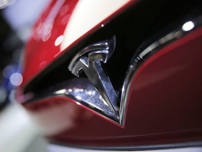 FILE - This Friday, Sept. 30, 2016, file photo shows the logo of the Tesla Model S on display at the Paris Auto Show in Paris. Tesla Inc. reports earnings Wednesday, Nov. 1, 2017. (AP Photo/Christophe Ena, File)