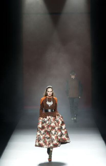 A model showcases designs by Ana Locking on the runway at the Mercedes-Benz Fashion Week in Madrid. 