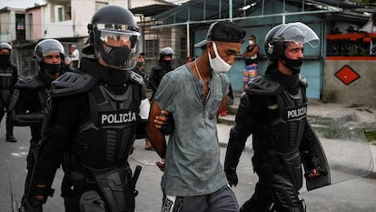 A man is arrested during a demonstration against the government of President Miguel Diaz-Canel in Havana on July 12, 2021.
