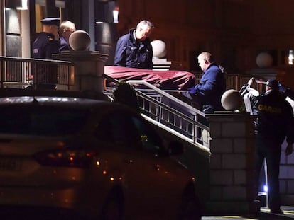 Police remove the body of David Byrne from the Regency Hotel in Dublin.