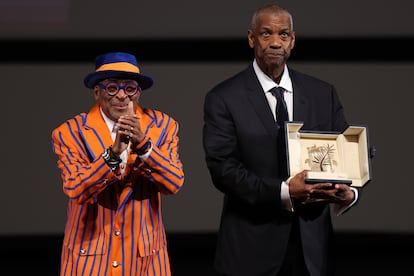 Actor Denzel Washington receives an Honorary Palme d'Or (Golden Palm) from director Spike Lee, left, ahead of the screening of the film "Highest 2 Lowest" at the 78th edition of the Cannes Film Festival in Cannes