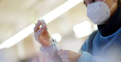 FILE PHOTO: COVID-19 vaccination continues on the first day of 2022, in Berlin