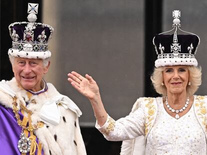 Britain's King Charles III and Queen Camilla wave from the Buckingham Palace balcony.