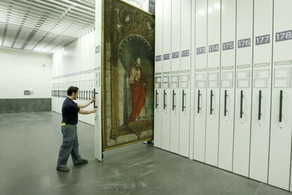 A museum workers opens up one of the vaults in the Jer&oacute;nomis Building storerooms.