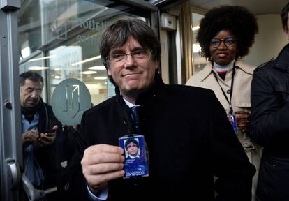 Carles Puigdemont with his accreditiation as an MEP.