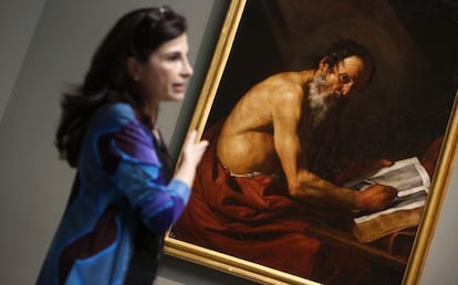 Restorer Almudena Sánchez, with 'Saint Jerome Writing,' newly attributed to José de Ribera.