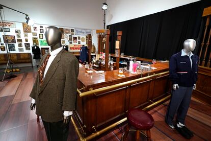 The bar used on the set of the television series "Cheers" and some costumes worn by actors on the sitcom are displayed, April 27, 2023, in Irving, Texas.