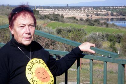 Activist Paca Blanco, with the luxury Marina Isla de Valdecañas development in the background.