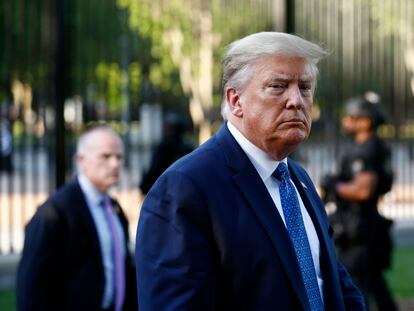 President Donald Trump returns to the White House after visiting outside St. John's Church, Monday, June 1, 2020, in Washington. Part of the church was set on fire during protests on Sunday night. (AP Photo/Patrick Semansky)