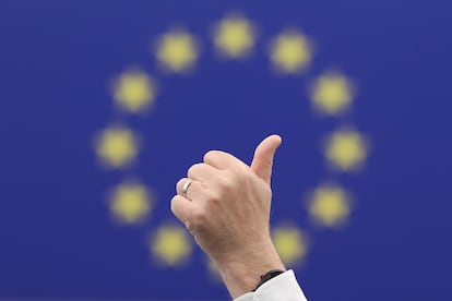 A member of the European Parliament takes part in a voting round during a plenary session in the European Parliament.