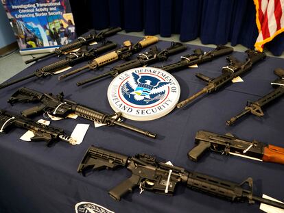 Firearms are displayed at the Miami Field Office of the Homeland Security Investigations, that was working with other agencies to crack down on an increase of firearms and ammunition smuggling to Haiti, in August 2022.