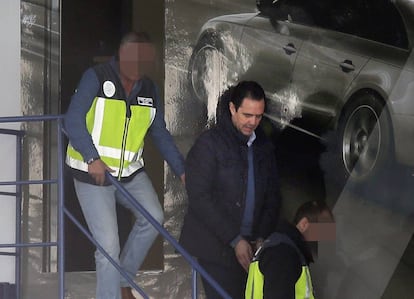 Miguel López in handcuffs following his arrest.