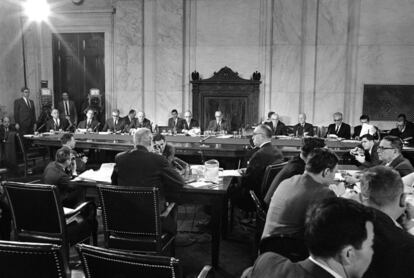 FILE - In this Feb. 10, 1966, file photo, a general views of the Senate Foreign Relations Committee hearing on Vietnam in Washington. George Kennan, former ambassador to Moscow, is at the witness table. Committee members, from left, are: Sens. Eugene McCarthy, D-Minn., Frank Carlson, R-Kansas, Bourke Hickenlooper, R-Iowa, Chairman William Fulbright, D-Ark., Wayne Morse, D-Ore., Albert Gore, D-Tenn., Frank Lausche, D-Ohio, Frank Church, D-Idaho, Joseph Clark, Jr., D-Pa., and Claiborne Pell, D-R.I. Washington knows how to do big hearings. Dramatic congressional hearings are something of a Washington art form, a rite of democracy carefully crafted for the cameras. Suspense is building as fired FBI Director James Comey prepares to claim the microphone June 8, 2017, in an austere, modern hearing room of the Hart Senate Office Building. (AP Photo/Henry Griffin, File)