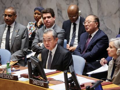 Chinese Foreign Minister Wang Yi and UN Security Council Affairs Division (SCAD) Director Claudia Banz attend a UN Council meeting on the conflict between Israel and Hamas, in New York City,  November 29, 2023.