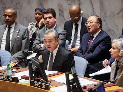 Chinese Foreign Minister Wang Yi and UN Security Council Affairs Division (SCAD) Director Claudia Banz attend a UN Council meeting on the conflict between Israel and Hamas, in New York City,  November 29, 2023.