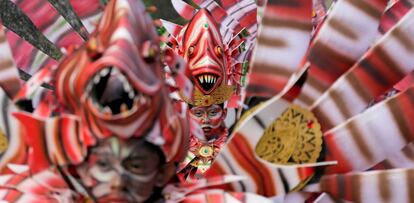 Balinese artists dressed in decorative costumes take part in the Maritime Festival at Pandawa Beach on the resort island of Bali