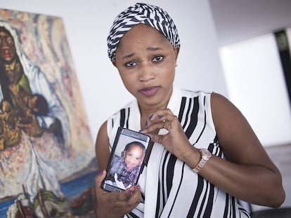 Mariam Berete with a photo of her biological son.