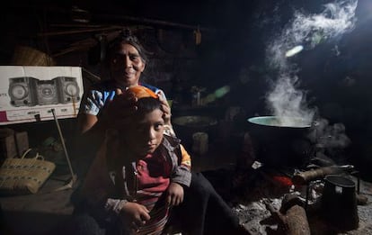 Micaela and her grandson in her kitchen in San Juan Chamula, Chiapas.