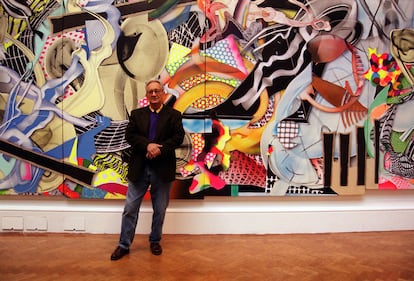 The American artist Frank Stella with one of his works exhibited at the Royal Academy exhibition, in London, in 2000.