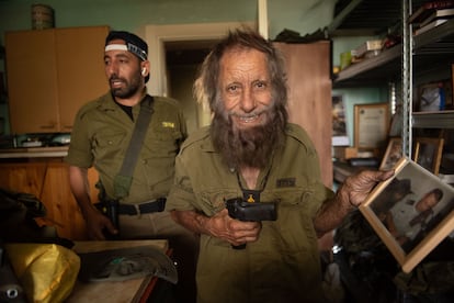 The reservist Ishashi El Hagah and his father Shlomo El Hagah in their home in Kyriat Shmona, near the border with Lebanon.