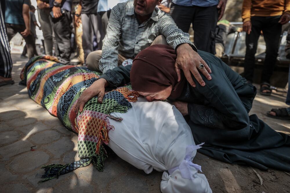 GAZA CITY, GAZA - JULY 2: Friends and relatives mourn after Indonesian Hospital director doctor Marwan al-Sultan was killed along with 7 members of his family following an Israeli attack on an apartment located in 17th Junction in Gaza City, Gaza on July 2, 2025.  Those who lost their lives and the wounded were brought to al Shifa Medical Center. (Photo by Ali Jadallah/Anadolu via Getty Images)