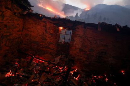 View inside a burned house during a wildfire in Videmonte, Celorico da Beira, Portugal, August 11, 2022. REUTERS/Pedro Nunes REFILE-QUALITY REPEAT