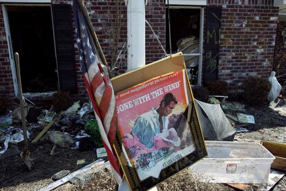 A movie poster for 'Gone with the Wind' sits in a front yard of a home damaged by Hurricane Katrina in Chalmette, Louisiana, in St. Bernard Parish, on September 28, 2005.