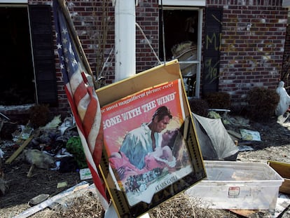 A movie poster for 'Gone with the Wind' sits in a front yard of a home damaged by Hurricane Katrina in Chalmette, Louisiana, in St. Bernard Parish, on September 28, 2005.