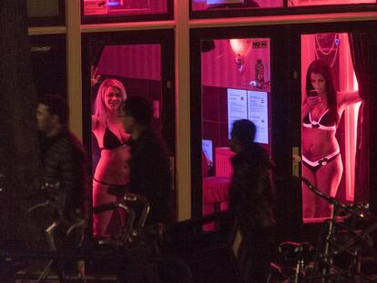 Sex workers in Amsterdam's red light district.