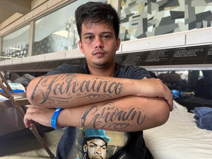 Richy Palalay, who was born and raise in the Hawaii town of Lahaina on the island of Maui, shows his "Lahaina Grown" tattoo at an evacuation shelter in Wailuku, Hawaii on Saturday, Aug. 12, 2023.