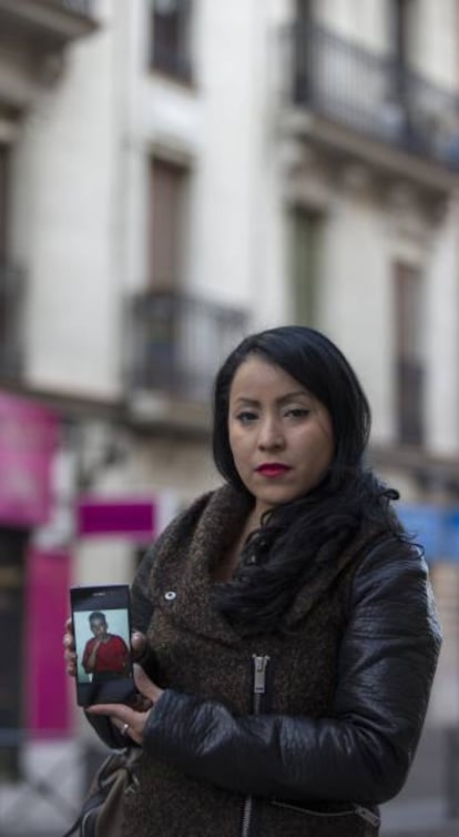Carmen Estacio with a photograph of her brother, Diego Armando.