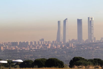 A cloud of smog hangs over downtown Madrid on October 27 2010.